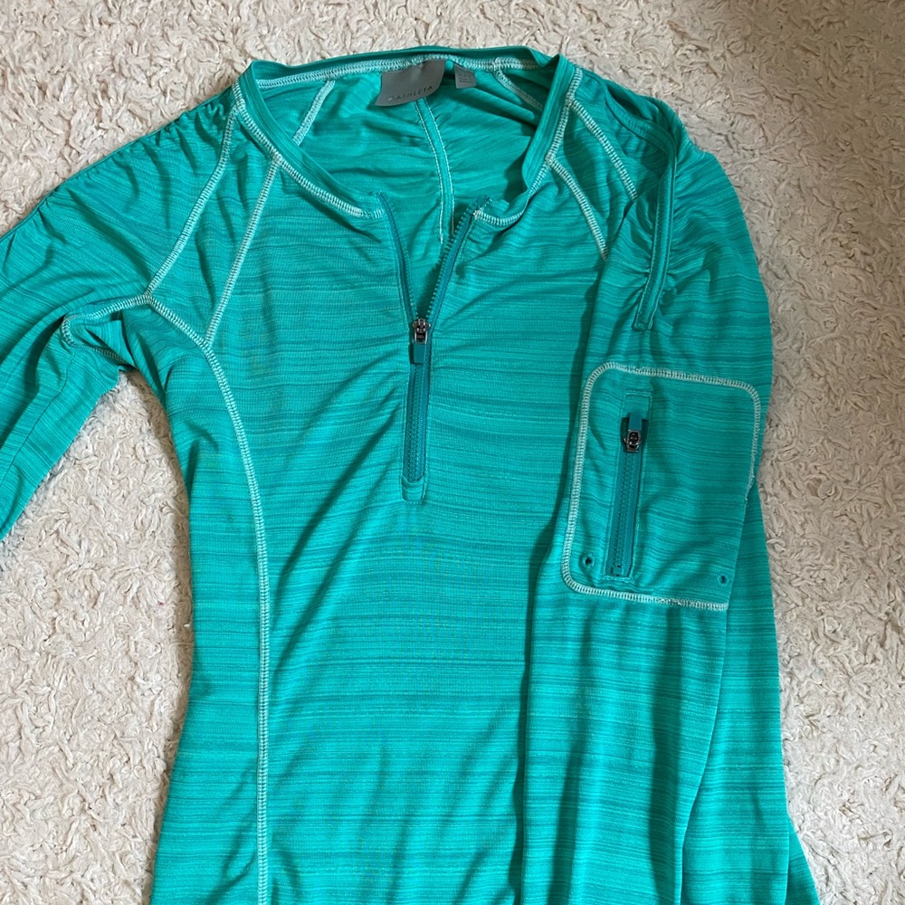 Athleta greenish blue long sleeve workout top. Size: XXS.
